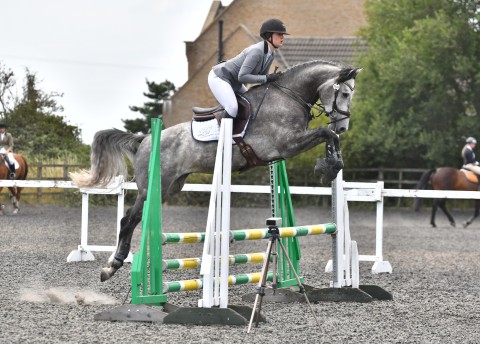 Cassionora GF jumping a fence